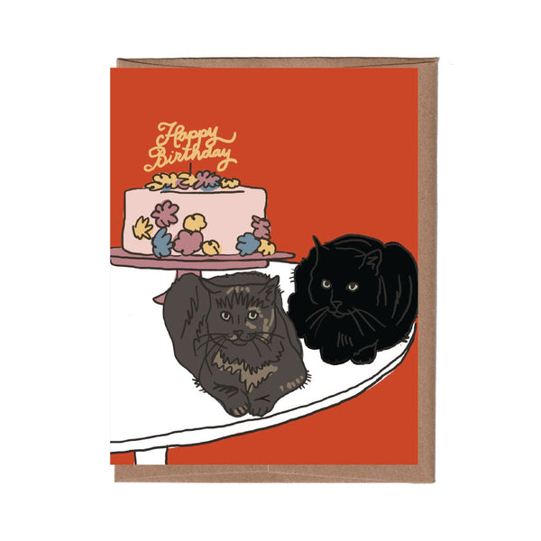 Birthday card with two cats and a cake on an orange background