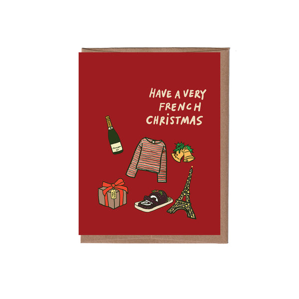 Red card with illustrations of a bottle, sweater, gift, baguette, and Eiffel Tower on a white background.